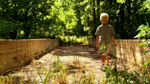 Young Boy on an Abandoned Bridge Stock Footage 371660