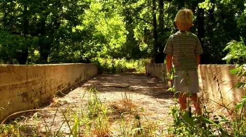 Young Boy on an Abandoned Bridge Stock Footage 371666