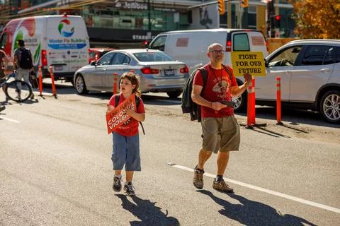 A young boy activist is walking down Cambie Street as part of the Global Cl.. Stock Photos