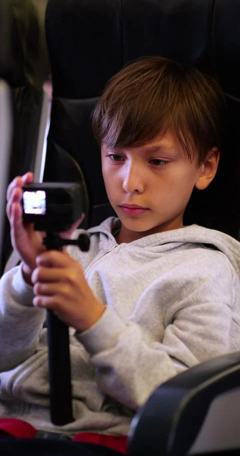 Young boy adjust setting and start shooting with action camera Video stock 324862010