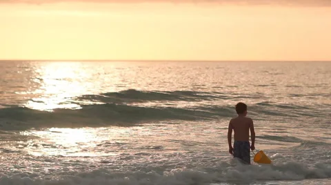 Young boy alone at beach Stock Footage 1003262
