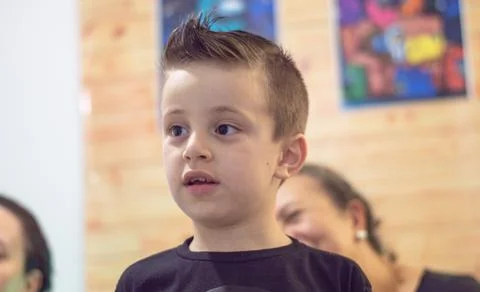 Young boy angry using a black t-shirt and looking to the side Stock Photos