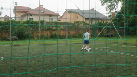 Young boy is attempting to dribble past a female coach during a soccer training Stock Footage 284226156
