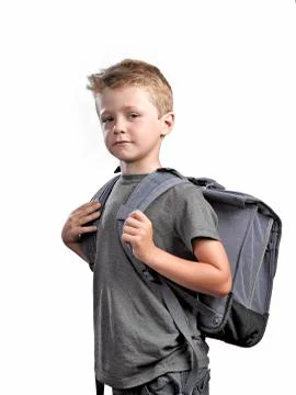 Young boy with backpack isolated on white background Stock Photos