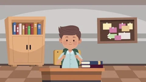 Young boy with backpack sitting at desk in classroom with books and bulleti.. Stock Footage 339272930