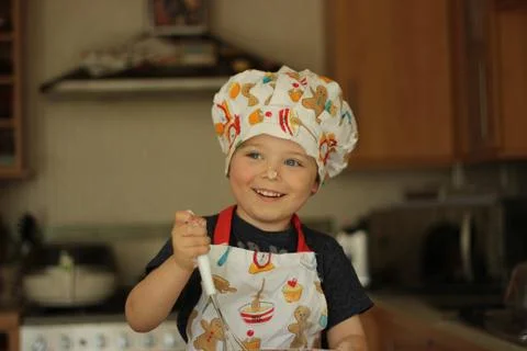 Young boy baking Stock Photos