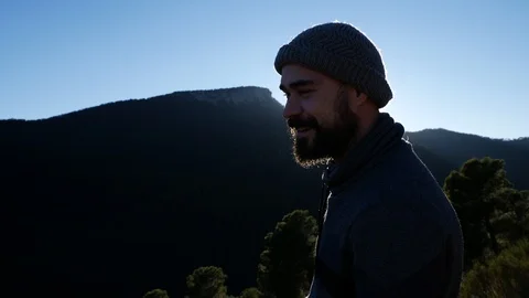 Young boy with beard and hat looking at a landscape and screaming Stock Footage 103312283