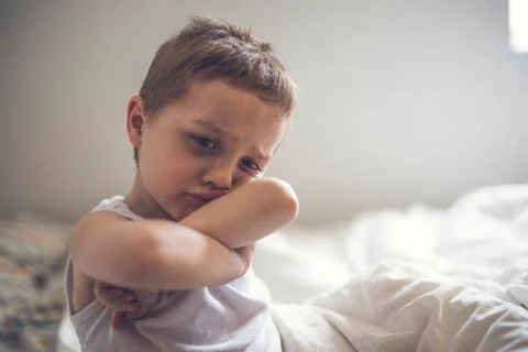 Young Boy on bed Фото