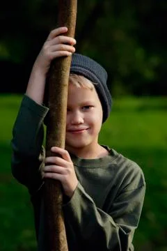 Young boy with big stick Stock Photos
