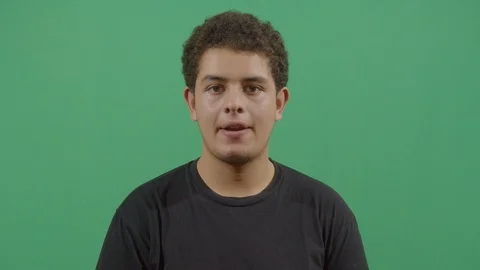 Young boy biting his lower lip like does not know the answer to a problem in Stock Footage 115339062