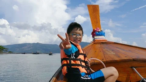 Young boy on the the boat Stock Footage 75513930