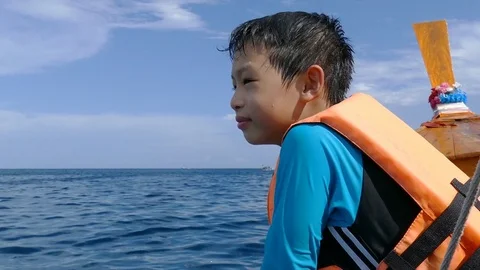 Young boy on the the boat Stock Footage 75514761
