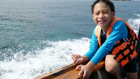 Young boy on the the boat Stock Footage 75516536