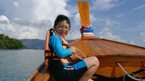 Young boy on the the boat Stock Footage 75518086