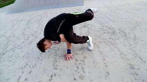 Young boy breakdancing in skate park Stock Footage 42640700