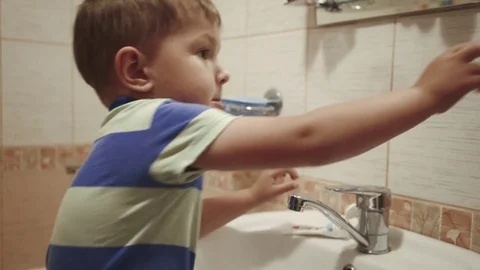 Young boy brushing his teeth Stock Footage 76606061