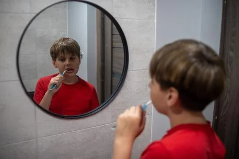Young Boy Brushing Teeth Bathroom Mirror Reflection Stock Photos