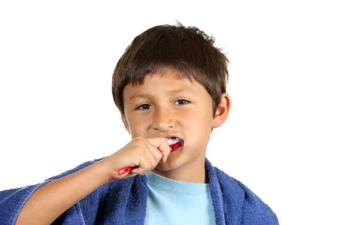 Young boy brushing teeth Stock Photos