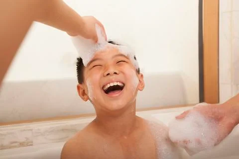 Young Boy in Bubble Bath Stock Photos