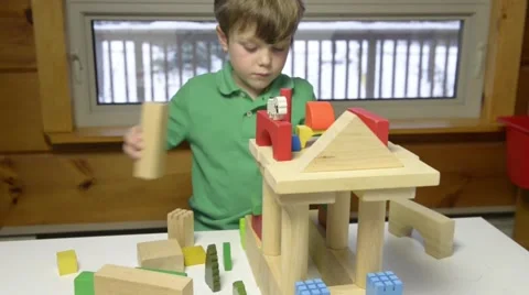 Young boy building with blooks Stock Footage 43965374