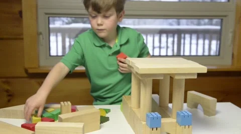 Young boy building with blooks Stock Footage 43965375