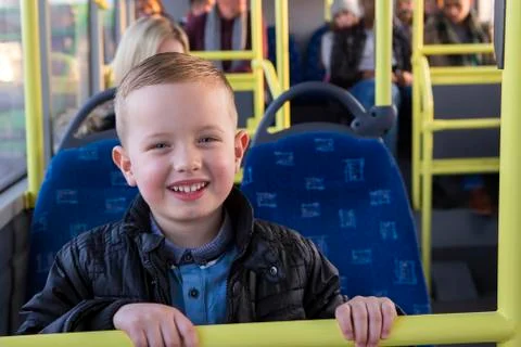 Young boy on the bus Photos