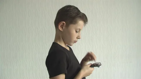 Young boy checking his  for the time on his wrist watch. Stock Footage 68432366