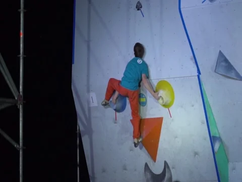 Young boy climbs artificial rock wall during the sport competition. Stock Footage 84731032