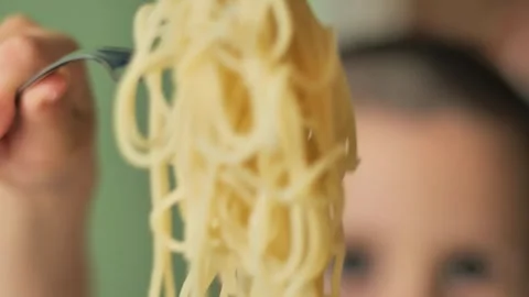A young boy Close-Up Showing Spaghetti Noodles Wrapped on a Fork Stock-Footage 312898947