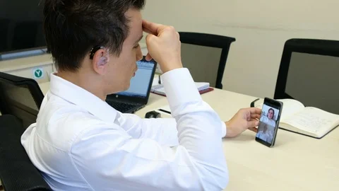 Young boy communicating with sign language  at smart phone Stock Footage 109339378