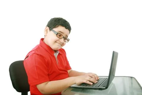 Young boy with computer isolated on white Stock Photos