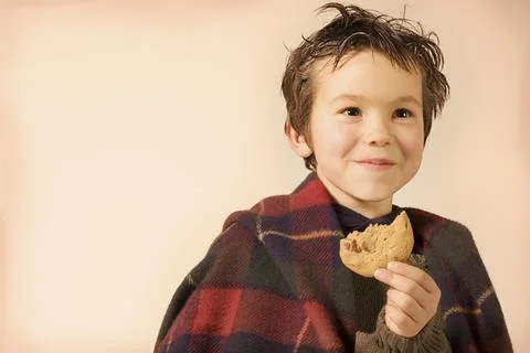 Young Boy With Cookie Stock Photos
