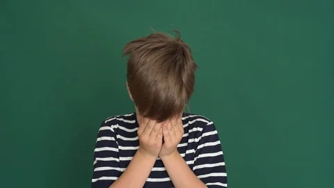 Young boy crying on the green screen Stock Footage 118372776