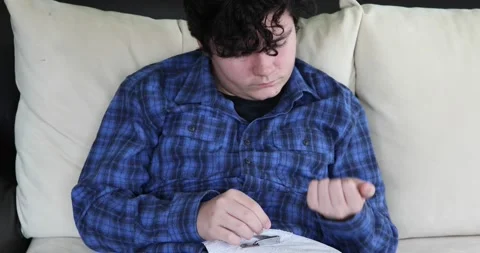 Young boy cutting nails using nail clipper 2 Stock Footage 147600247