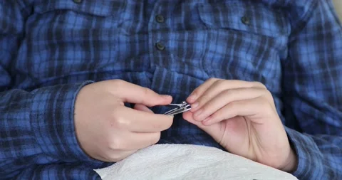 Young boy cutting nails using nail clipper 5 Stock Footage 147602628