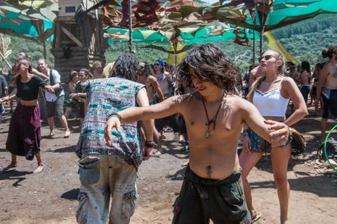 A young boy dances uninhibited on the main stage of the Lost Theory psytransce Stock Photos