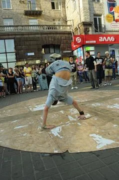 Young boy dancing break dance on the street, crowd of people watching. Kyiv, Stock Photos