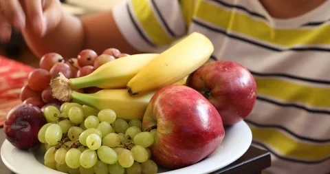 Young boy with different kind of fruit plate 2 Stock Footage 115967827