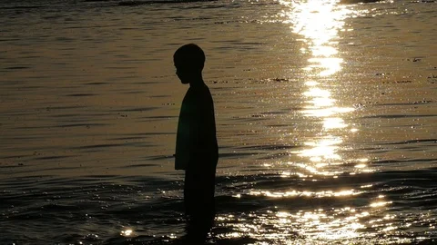 Young boy doing a dance in the ocean. Stock-Footage 97097030