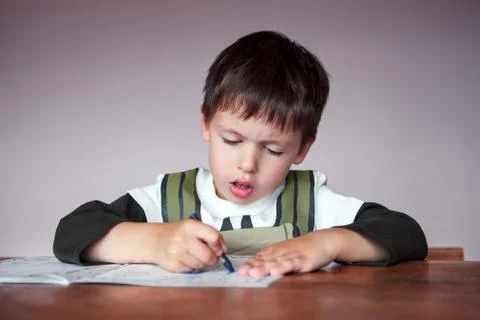 Young boy doing his homework at home Foto stock