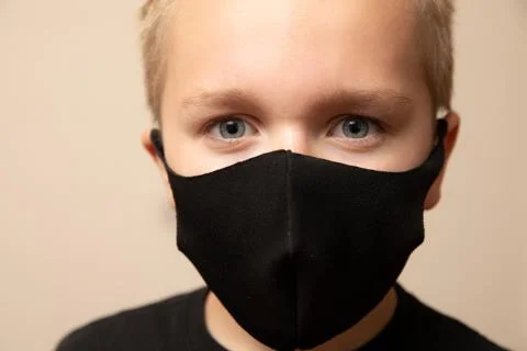 Young boy doing his part to flatten the curve Stock Photos