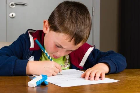 Young boy doing homework Stock Photos