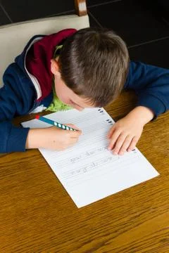 Young boy doing homework Stock Photos