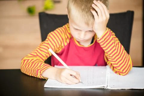 Young boy doing math homework Stock Photos