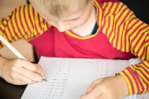 Young boy doing math homework Stock Photos