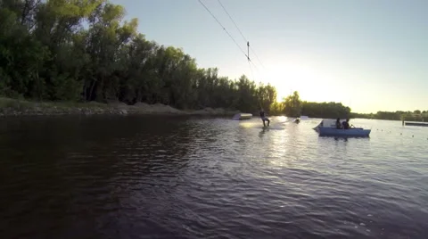 Young boy doing tricks on a wakeboard. Slow motion. Stock Footage 56195748