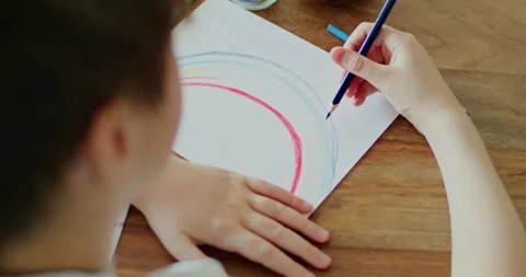Young boy drawing rainbow during Covid-19 quarantine at home. Stay at home Video stock 134697199