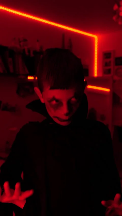 Young boy dressed in black and looking scary, dancing, halloween, vertical Stock Footage 219274660
