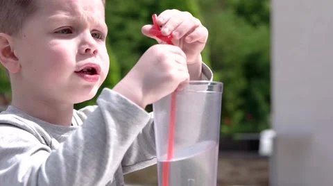 Young Boy Drinking Juice in Cafe Outdoor Stock Footage 62781433