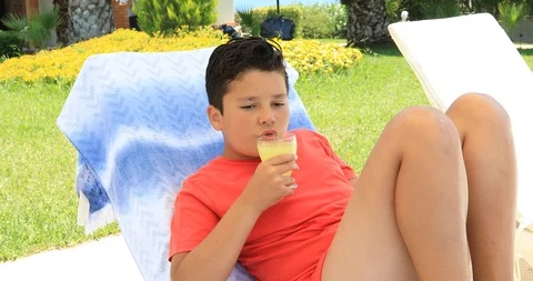 Young boy drinking lemonade at the garden Stock-Footage 92255998